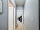 Gray hallway with carpet and doors to bedrooms at 1940 Banner Ln, St Cloud, FL 34769