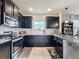 Modern kitchen with stainless steel appliances and granite countertops at 1940 Banner Ln, St Cloud, FL 34769
