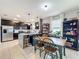 Open kitchen with island, stainless steel appliances, and a breakfast nook at 1940 Banner Ln, St Cloud, FL 34769
