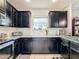 Modern kitchen with stainless steel appliances and granite countertops at 1940 Banner Ln, St Cloud, FL 34769