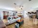 Spacious living room with hardwood floors, ceiling fan, and comfortable seating at 1940 Banner Ln, St Cloud, FL 34769