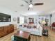 Comfortable living room with hardwood floors and open concept to dining area at 1940 Banner Ln, St Cloud, FL 34769