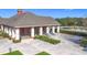 Community pool deck with lounge chairs and tables under covered area at 1940 Banner Ln, St Cloud, FL 34769