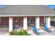 Brick community pool deck with tables and chairs under covered area at 1940 Banner Ln, St Cloud, FL 34769