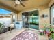 Relaxing screened patio with ceiling fan and access to backyard at 1940 Banner Ln, St Cloud, FL 34769