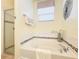 Relaxing bathroom with a soaking tub, separate shower, and elegant tile accents at 4191 Oaktree Drive, Davenport, FL 33837