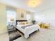 Comfortable bedroom with neutral tones, tiled floors, and ample natural light at 4191 Oaktree Drive, Davenport, FL 33837