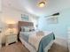 Charming bedroom with nautical decor, a woven headboard, and soft blue accents for a serene atmosphere at 4191 Oaktree Drive, Davenport, FL 33837