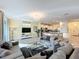 Bright and spacious living room with tile flooring, an open layout, and abundant natural light at 4191 Oaktree Drive, Davenport, FL 33837