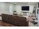 Well-lit living room with stylish seating and a wall-mounted television at 4950 Nova Ave, St Cloud, FL 34773