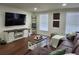 Living room featuring a TV, stylish console and comfortable seating at 4950 Nova Ave, St Cloud, FL 34773