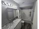 Bathroom features a shower and tub combination and granite countertop at 5267 Images Cir # 303, Kissimmee, FL 34746