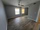 Bedroom with tile floors, ceiling fan, and a mirror closet at 5267 Images Cir # 303, Kissimmee, FL 34746