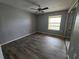 Bedroom with wood look flooring and a large mirror closet at 5267 Images Cir # 303, Kissimmee, FL 34746