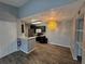 View of kitchen with stainless steel appliances, black cabinets, wood-look floors and gray walls at 5267 Images Cir # 303, Kissimmee, FL 34746