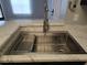 Modern stainless steel kitchen sink with a gooseneck faucet at 5267 Images Cir # 303, Kissimmee, FL 34746