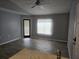 View of a living room with sliding doors and tile flooring at 5267 Images Cir # 303, Kissimmee, FL 34746
