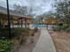 Exterior view of community pool and path leading to the pool area and clubhouse at 5267 Images Cir # 303, Kissimmee, FL 34746