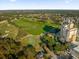 Aerial view showcasing resort amenities and golf course at 7593 Gathering Dr # 608, Reunion, FL 34747