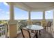 Expansive balcony with panoramic views and a bistro set at 7593 Gathering Dr # 608, Reunion, FL 34747