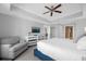 Comfortable bedroom with ample closet space and sitting area at 7593 Gathering Dr # 608, Reunion, FL 34747