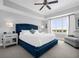 Serene main bedroom with a plush bed and large window at 7593 Gathering Dr # 608, Reunion, FL 34747