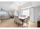 Formal dining area with chandelier and large windows at 7593 Gathering Dr # 608, Reunion, FL 34747