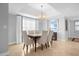 Formal dining area with chandelier and large windows at 7593 Gathering Dr # 608, Reunion, FL 34747