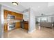 Modern kitchen with stainless steel appliances and wood cabinets at 7593 Gathering Dr # 608, Reunion, FL 34747