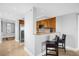 Modern kitchen with stainless steel appliances and wood cabinets at 7593 Gathering Dr # 608, Reunion, FL 34747
