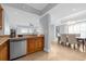 Modern kitchen with stainless steel appliances and wood cabinets at 7593 Gathering Dr # 608, Reunion, FL 34747