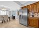 Modern kitchen with stainless steel appliances and wood cabinets at 7593 Gathering Dr # 608, Reunion, FL 34747