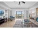 Spacious living room with balcony access and city views at 7593 Gathering Dr # 608, Reunion, FL 34747