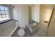 Bathroom featuring granite vanity, tub with shower and window offering natural light at 1069 Universal Rest Pl, Kissimmee, FL 34744