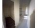 Hallway to primary bathroom with walk-in closet at 1069 Universal Rest Pl, Kissimmee, FL 34744