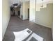 Open-concept room featuring wood flooring, a spiral staircase, and lots of light at 1069 Universal Rest Pl, Kissimmee, FL 34744