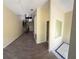 Open-concept room featuring wood flooring, a spiral staircase, and lots of light at 1069 Universal Rest Pl, Kissimmee, FL 34744