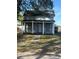 Charming home featuring a covered front porch and well-maintained lawn at 1700 Kentucky Ave, St Cloud, FL 34769