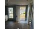Open-concept kitchen space leading to the front door at 1700 Kentucky Ave, St Cloud, FL 34769