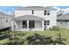 Two story home with covered patio and grassy backyard at 1740 Carnelian St, Deland, FL 32720
