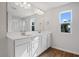 Double vanity bathroom with white cabinets and tile floor at 1740 Carnelian St, Deland, FL 32720