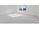 Large bedroom featuring grey carpet and natural light at 1740 Carnelian St, Deland, FL 32720