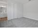 Bright bedroom with grey carpet, walk-in closet, and ensuite bathroom at 1740 Carnelian St, Deland, FL 32720