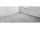 Spacious bedroom with grey carpet and a window view at 1740 Carnelian St, Deland, FL 32720