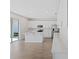 Modern kitchen with white cabinets, island, and stainless steel appliances at 1740 Carnelian St, Deland, FL 32720