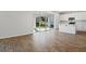 Open concept kitchen with island and sliding glass doors to patio at 1740 Carnelian St, Deland, FL 32720