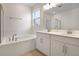 Bathroom featuring a soaking tub, double vanity, and modern finishes at 1742 Carnelian St, Deland, FL 32720