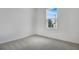 Cozy bedroom with neutral carpet and a window that provides plenty of natural light at 1742 Carnelian St, Deland, FL 32720