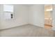 Bedroom featuring plush carpeting, natural light, and a view into the bathroom at 1742 Carnelian St, Deland, FL 32720