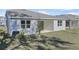 View of home's exterior, showcasing backyard and patio at 1744 Carnelian St, Deland, FL 32720
